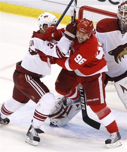 Tomas Holmstrom Coyotes Adrian Aucoin takes on Red Wings Tomas Holmstrom in the 2010 NHL Playoffs (AP Phote/Carlos Osorio)
