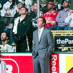 Modano watches highlights prior to dropping the puck (Ross Bonander/THW)