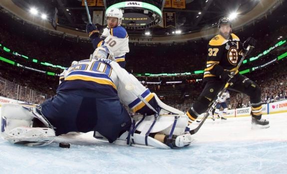 St. Louis Blues Jordan Binnington Boston Bruins' Patrice Bergeron
