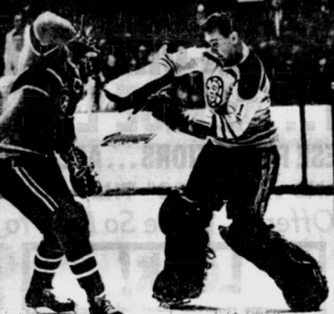 Ed Johnston battles Jean Beliveau in last night's game.