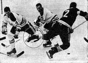Blades' Gary Kilpatrick trips Jack Evans of the Seals.