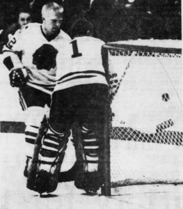 Chicago's Pat Stapleton and goalie Denis DeJordy cover a shot by Detroit's alex Delvecchio.